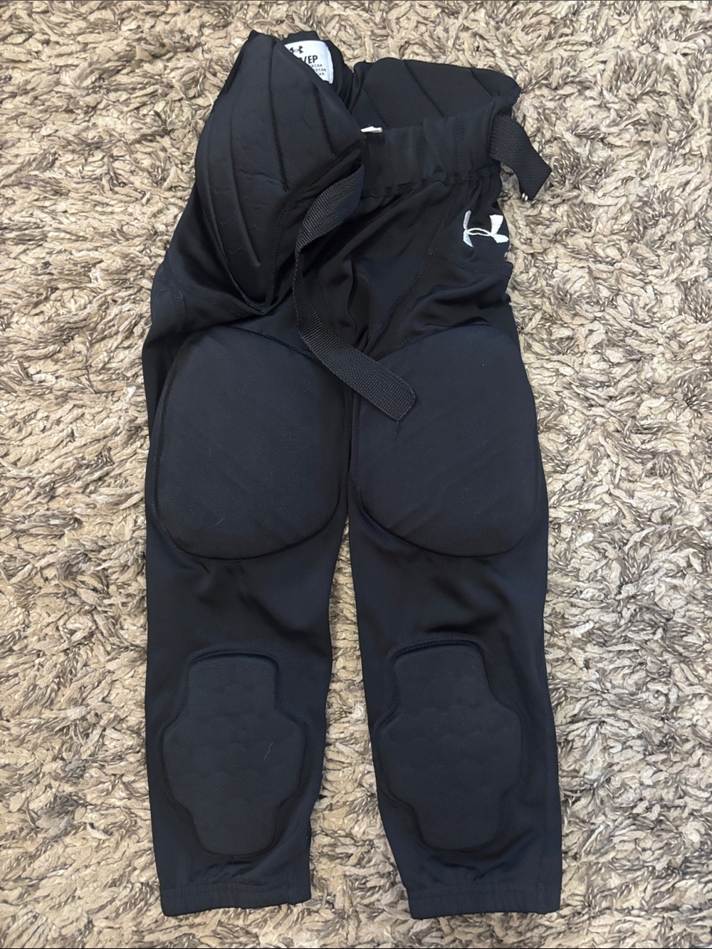 Under Armour Black Padded Youth Football pants.